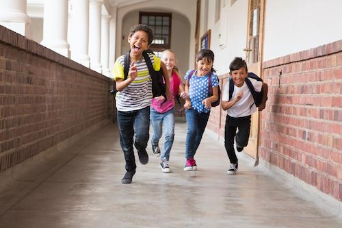 Cute pupils running down the hall